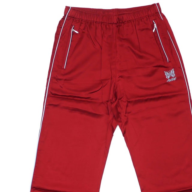 needles track pants red