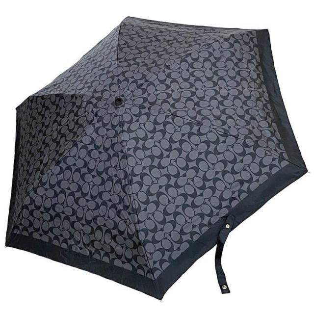 コーチ 折りたたみ傘 ec-21279 ブラック グレー シグネチャー 未使用 美品 日傘 雨傘 ポリエステル Sランク COACH ロゴ 総柄 傘 タグ付 コンパクト 小さい ミニ 定番 人気 小物 プレゼント ギフト 贈り物 黒 灰色 お洒落 畳める 高級感 ブランド 本物 鑑定済みの通販は 9,800円