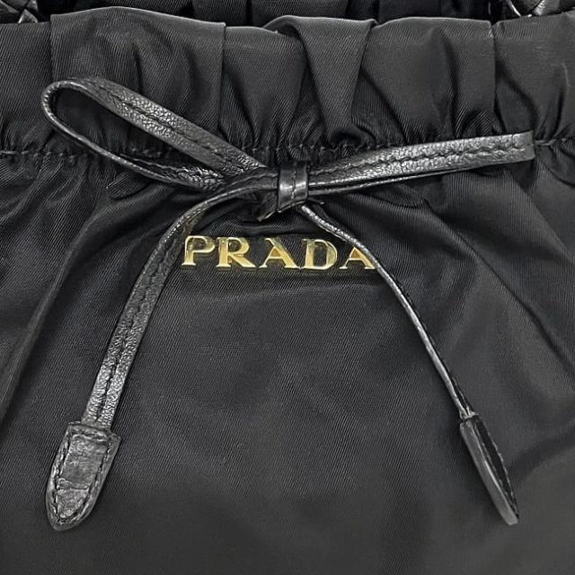 プラダ ハンドバッグ ec-22760 ブラック NERO BN1631 美品 ナイロン レザー 中古 31 PRADA リボン ワンポイント ロゴ 軽い ギャザー ヴィンテージ シンプル 黒 人気 定番 お洒落 上品 可愛い 高級感 エレガント レディース 女性 ブランド 本物 鑑定済み プラダ ハンドバッグ ec-22760 ブラック NERO BN1631 美品 ナイロン