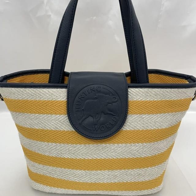 ハンティングワールド トートバッグ アットイーズトラディション イビザ ec-23533 イエロー ベージュ ネイビー 美品 コットン キャンバス レザー 中古 HUNTING WORLD ボーダー フラップ 軽い ファスナー 定番 人気 黄色 トート 高級感 ブランド 本物 鑑定済み ハンティングワールド トートバッグ アットイーズトラディション