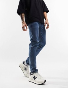 エイソス メンズ デニムパンツ ボトムス ASOS DESIGN skinny jeans in flat mid wash blue Mid wash blue