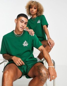 ニューバランス レディース Tシャツ トップス New Balance Members Club unisex t-shirt in dark green DARK GREEN