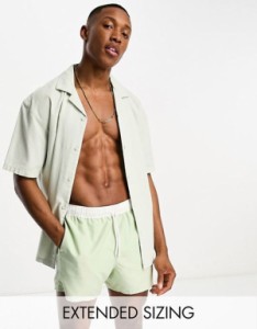 エイソス メンズ ハーフパンツ・ショーツ 水着 ASOS DESIGN swim shorts in short length with contrast waistband in light green Light