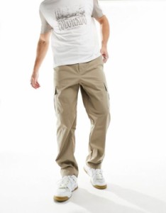 ナイキ メンズ カジュアルパンツ ボトムス Nike Club woven pants in beige GREEN