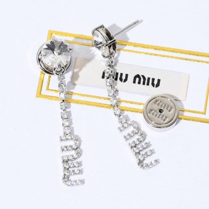 MIU MIU ミュウ ミュウ ピアス アクセサリー ロゴクリスタルピアス ...