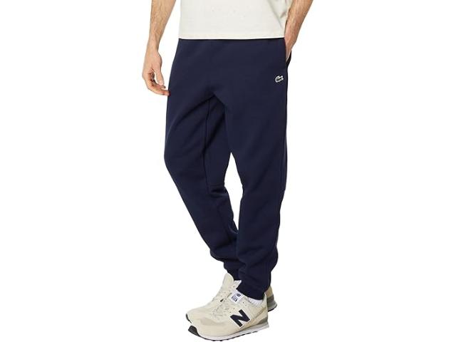 (取寄) ラコステ メンズ エッセンシャル フリース スウェットパンツ ウィズ リブド アンクル オープニング Lacoste men Essentials Fleece Sweatpants with Ribbed Ankle Opening Navy Blue