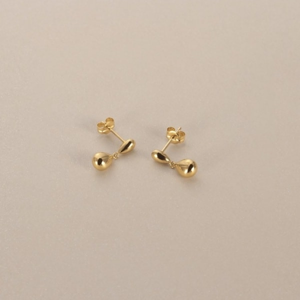 ココシュニック（COCOSHNIK）/K18中空ペアシェイプ大小 スタッドピアス