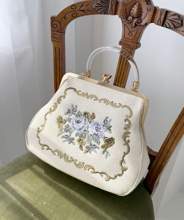 アンアナザーアンジェラス（an another angelus）/クリアハンドルローズ刺繍がま口バッグ