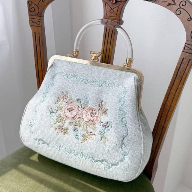 アンアナザーアンジェラス（an another angelus）/クリアハンドルローズ刺繍がま口バッグ