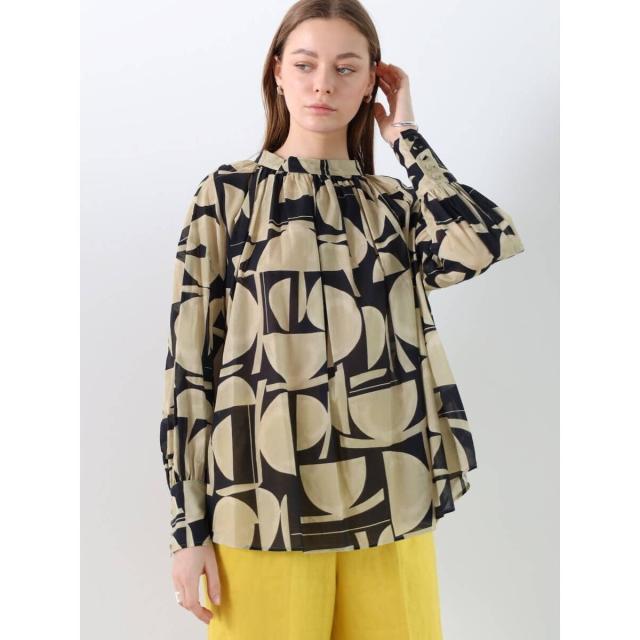 アーガ（Aga）/幾何柄バックボタンブラウスの通販は