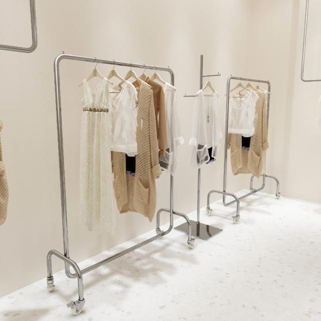 服飾店用衣類掛け軸 ステンレス製ベルト付きホイール 銀色中島型フロアディスプレイラック 女性服店棚 装示ラック
