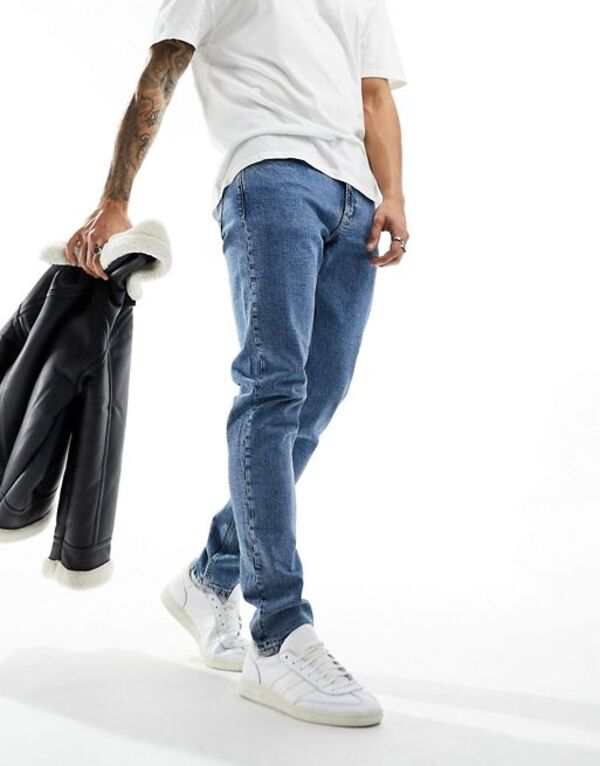 カルバンクライン メンズ デニムパンツ ボトムス Calvin Klein Jeans slim taper jeans in light wash Denim Lightの通販は
