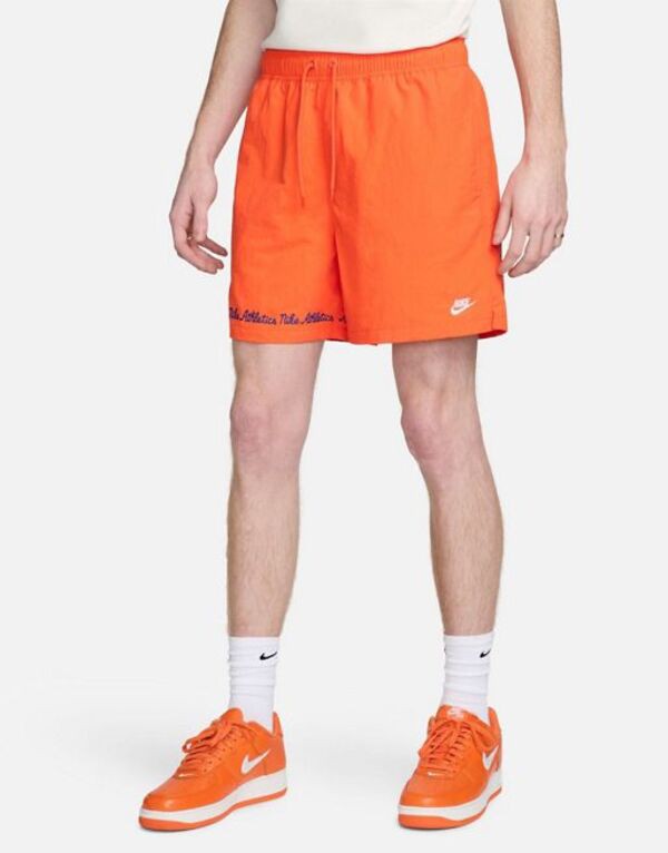 ナイキ メンズ ハーフパンツ・ショーツ ボトムス Nike Club varsity shorts in orange ORANGE