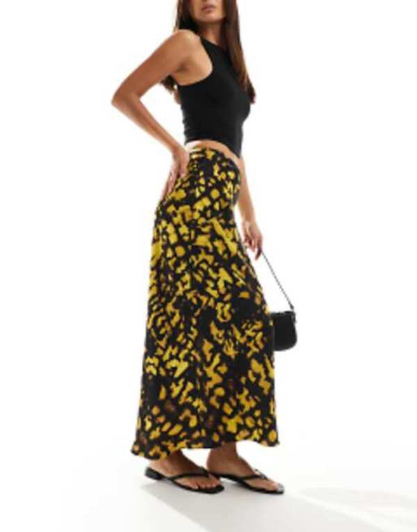 エイソス レディース スカート ボトムス ASOS DESIGN satin bias cut midi skirt in yellow and black splotch print Yellow/black