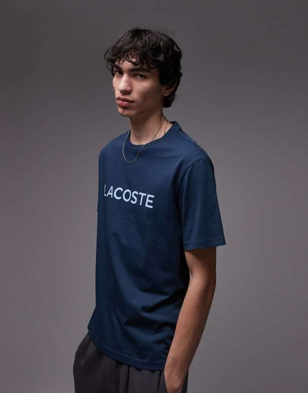 ラコステ メンズ Tシャツ トップス Lacoste loungewear T-shirt in navy blue with logo print Navy
