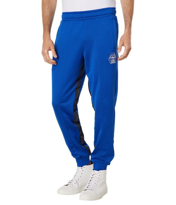 プーマ メンズ カジュアルパンツ ボトムス Rhuigi Track Pants Surf the Webの通販は
