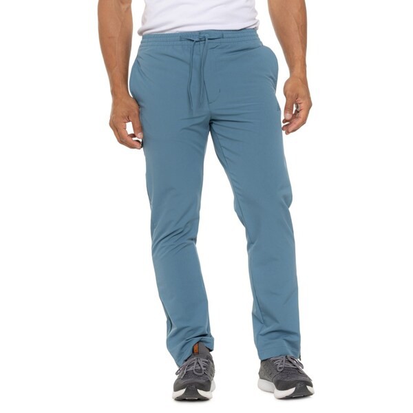 ニューバランス メンズ カジュアルパンツ ボトムス New Balance Woven All-Motion Tapered Pants Elemental Blueの通販は