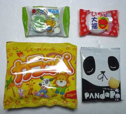 お菓子 詰め合わせ ディズニー カラフル巾着袋入り １００円の通販はau Pay マーケット はらしょう