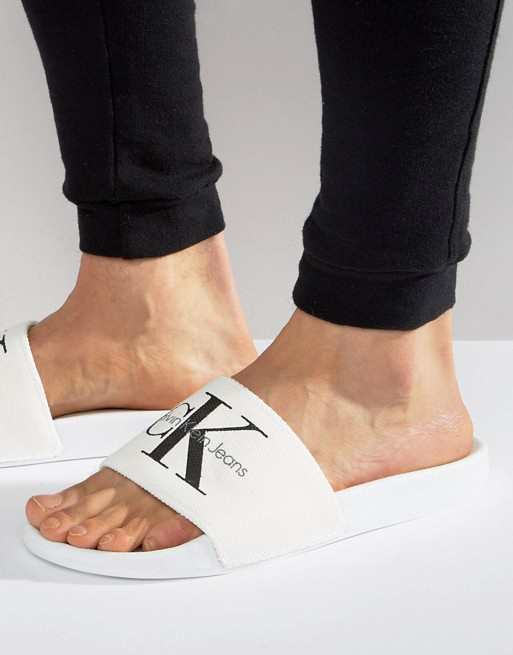 white calvin klein sliders