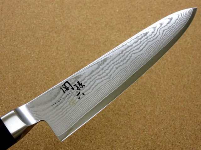 関の刃物 牛刀 18cm (180mm) 貝印 関孫六 ダマスカス ステンレス複合材(刃材:特殊ステンレス刃物鋼 合せ材:ステンレススチール)  口金付き 積層強化木ハンドル 家庭用の洋包丁 精肉の仕分け 魚の処理 野菜切り パン切りなど様々な用途に多種多様な両刃万能包丁 国産日本製 ...