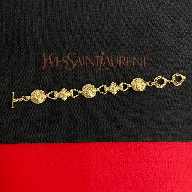 YVES SAINT LAURENT イヴ・サンローラン ロゴ GP ブレスレット ゴールド 112-1の通販は