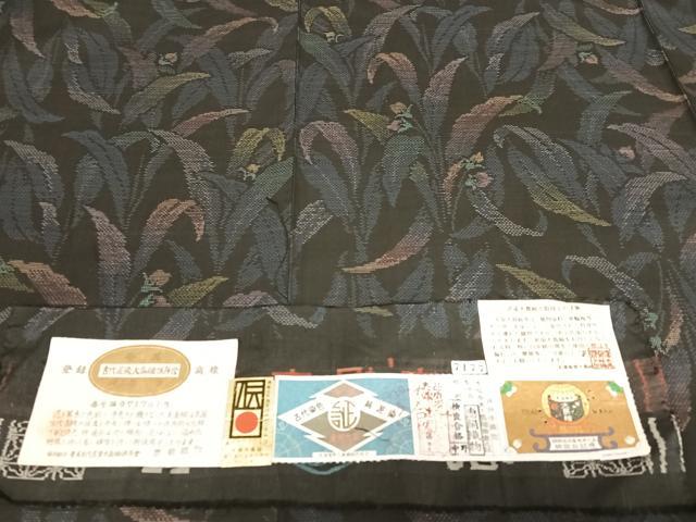 平和屋着物○本場大島紬 純泥染 手織 カタス7マルキ 流水文 岡江