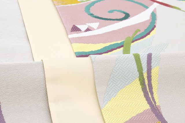 訳あり 袋帯 未仕立て 志都香 薄灰色 ライトグレー 青 黄色 露芝 唐草